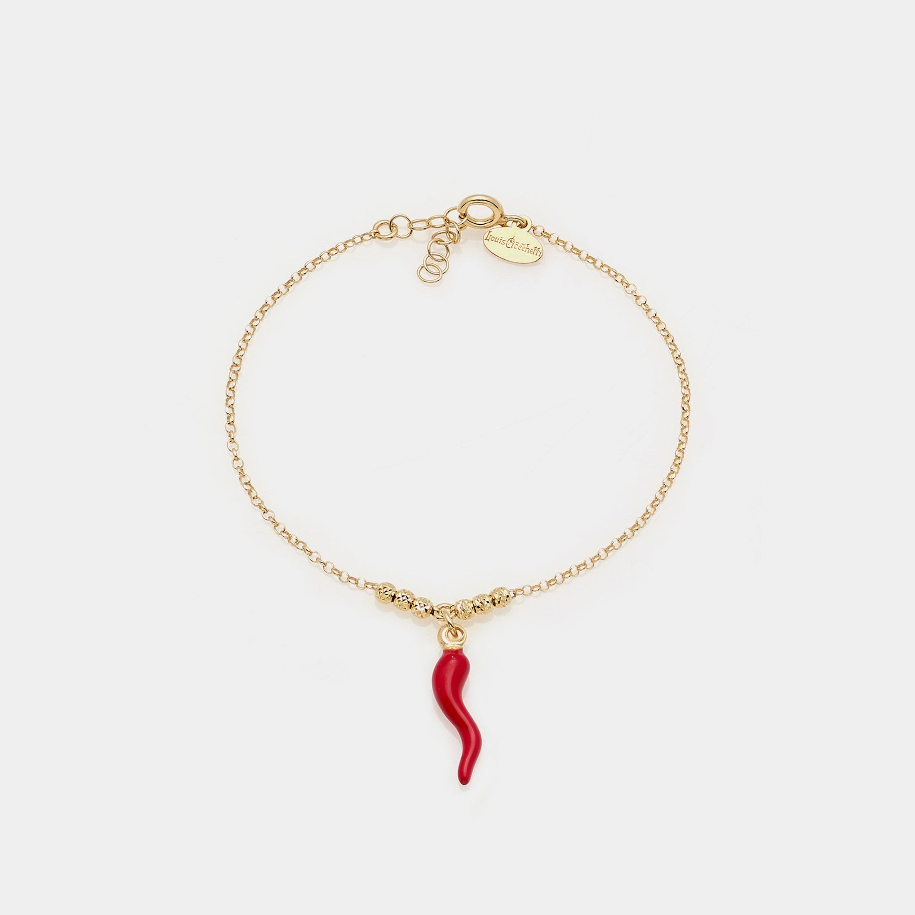 Gold-plated silver bracelet with faceted spheres and central red enameled horn pendant