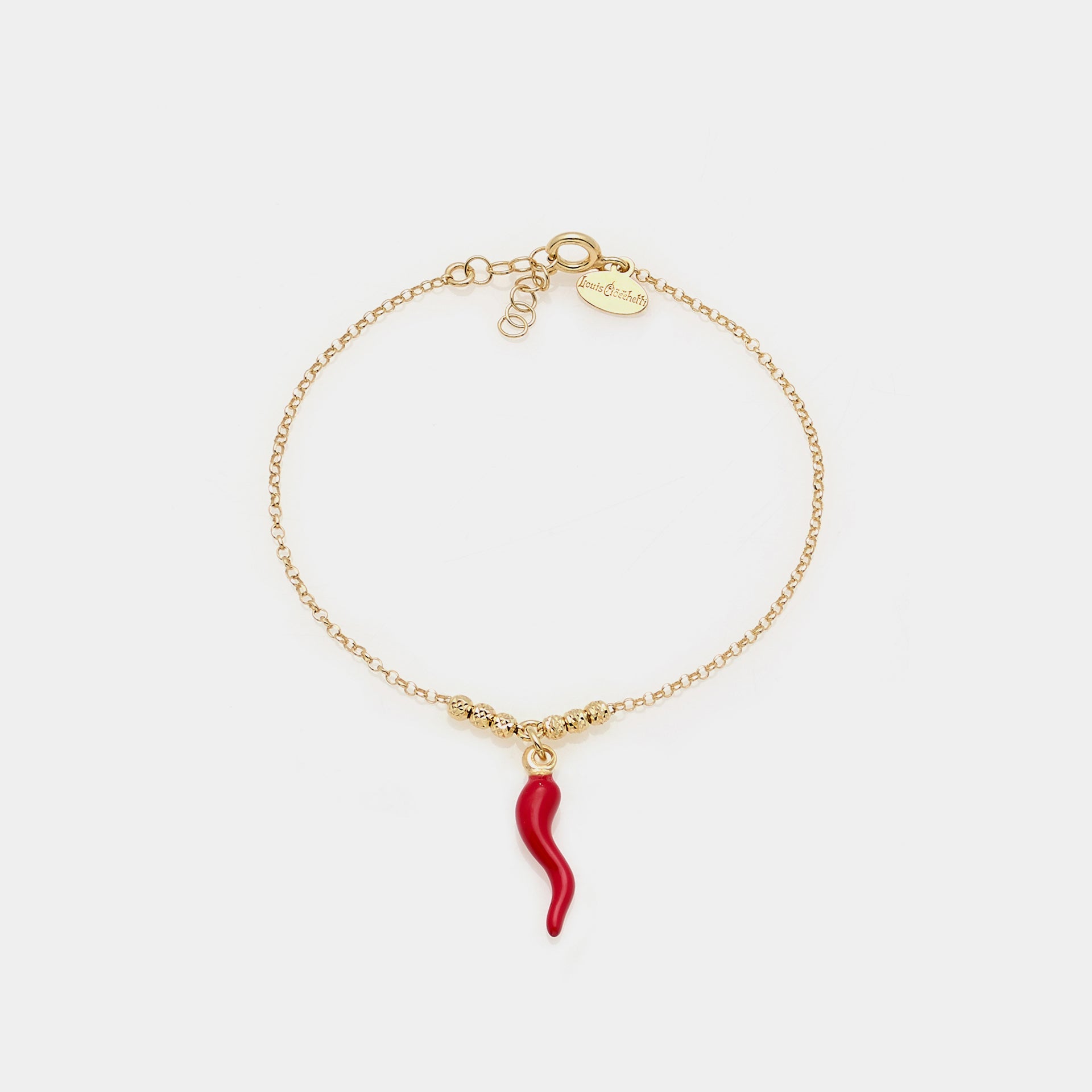 Gold-plated silver bracelet with faceted spheres and central red enameled horn pendant
