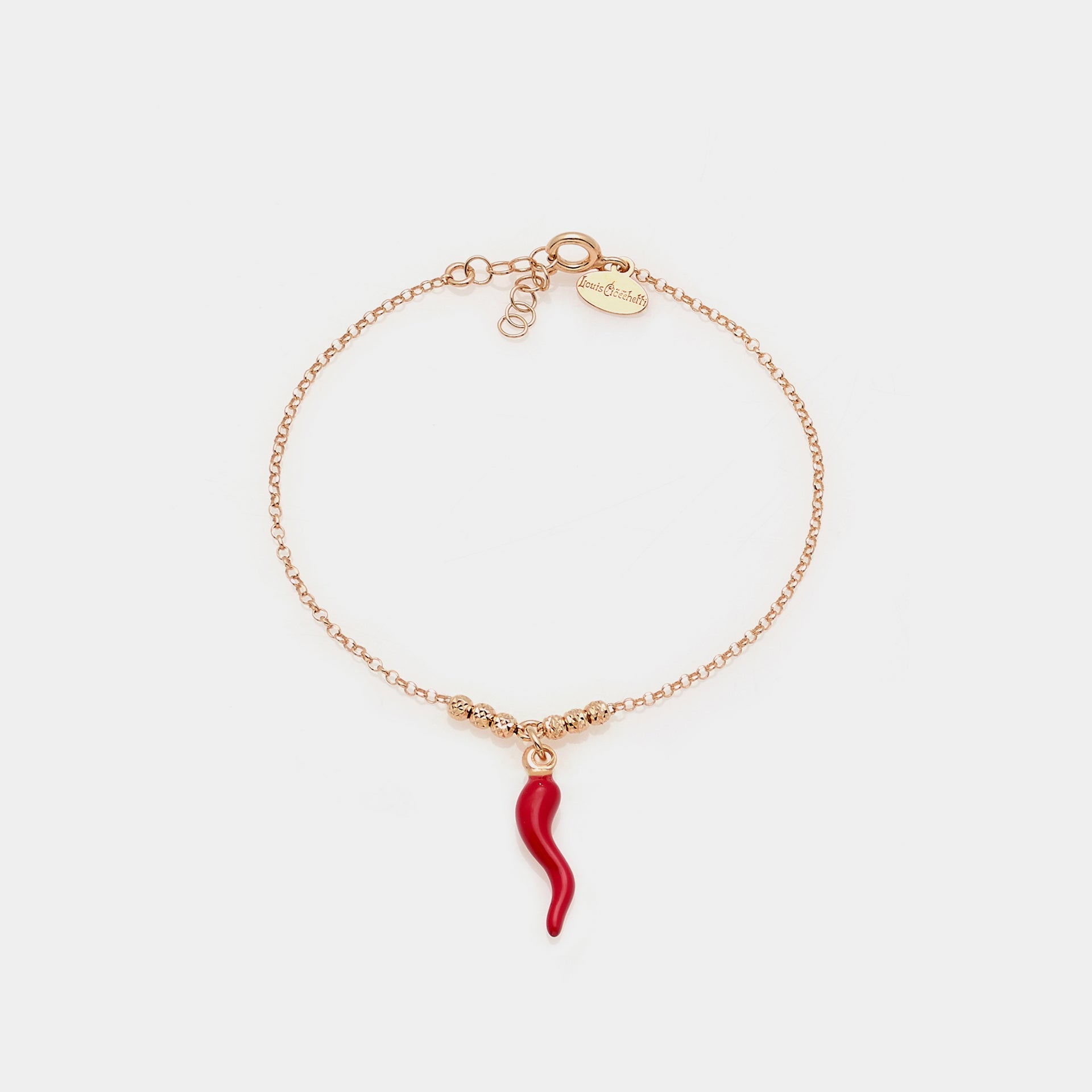 Rose gold plated silver bracelet with faceted spheres and central hanging red enameled horn