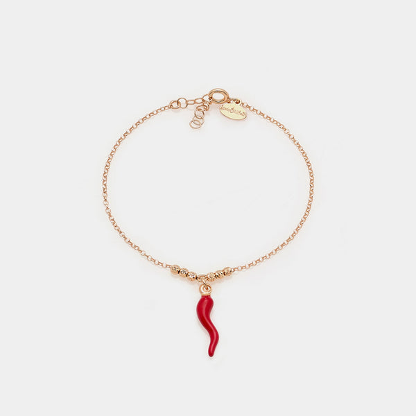 Bracciale argento rosato con sfere sfaccettate e corno smaltato rosso bombato pendente centrale