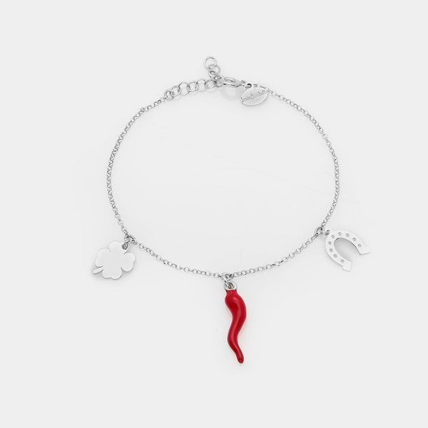 Rhodium-plated silver bracelet with enameled horn, clover, and horseshoe pendants