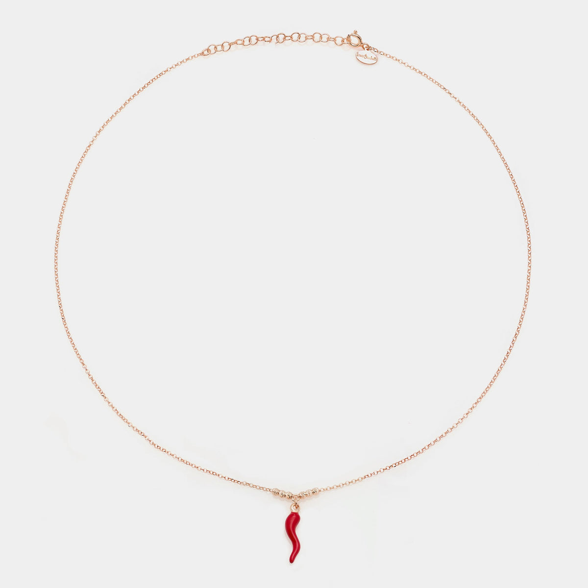Rose gold silver necklace with enameled horn pendant and 3 faceted spheres on the sides