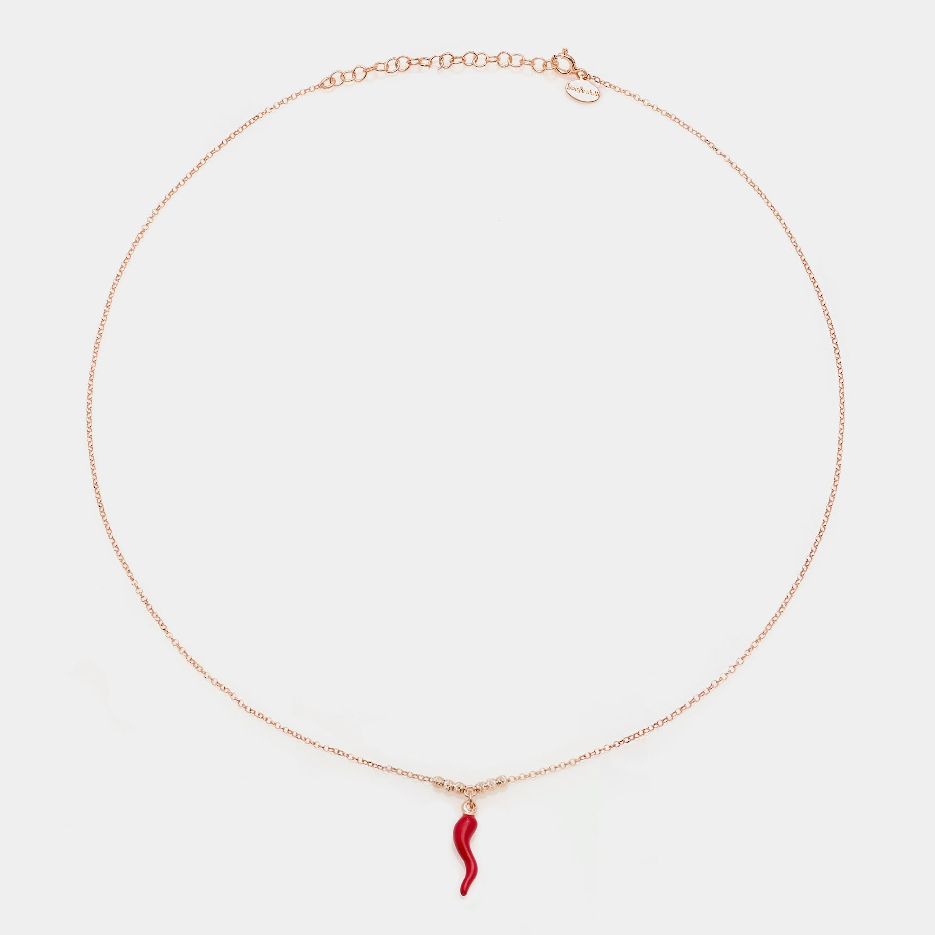 Rose gold silver necklace with enameled horn pendant and 3 faceted spheres on the sides