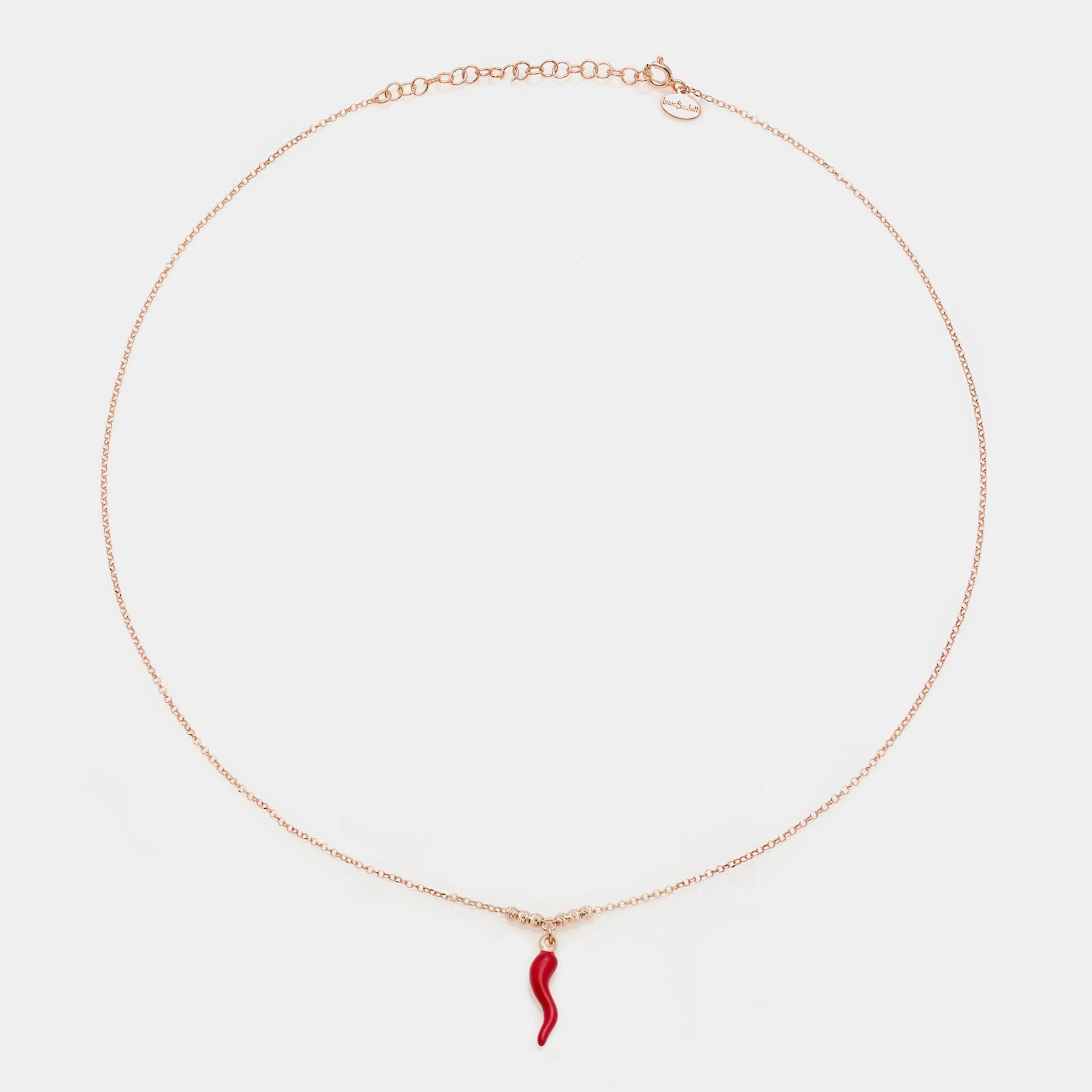 Rose gold silver necklace with enameled horn pendant and 3 faceted spheres on the sides
