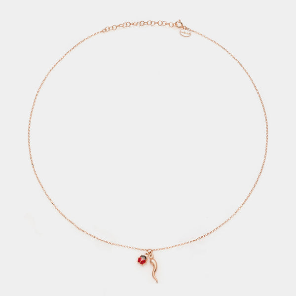 Rose gold silver necklace with horn centerpiece and enamel ladybug pendants
