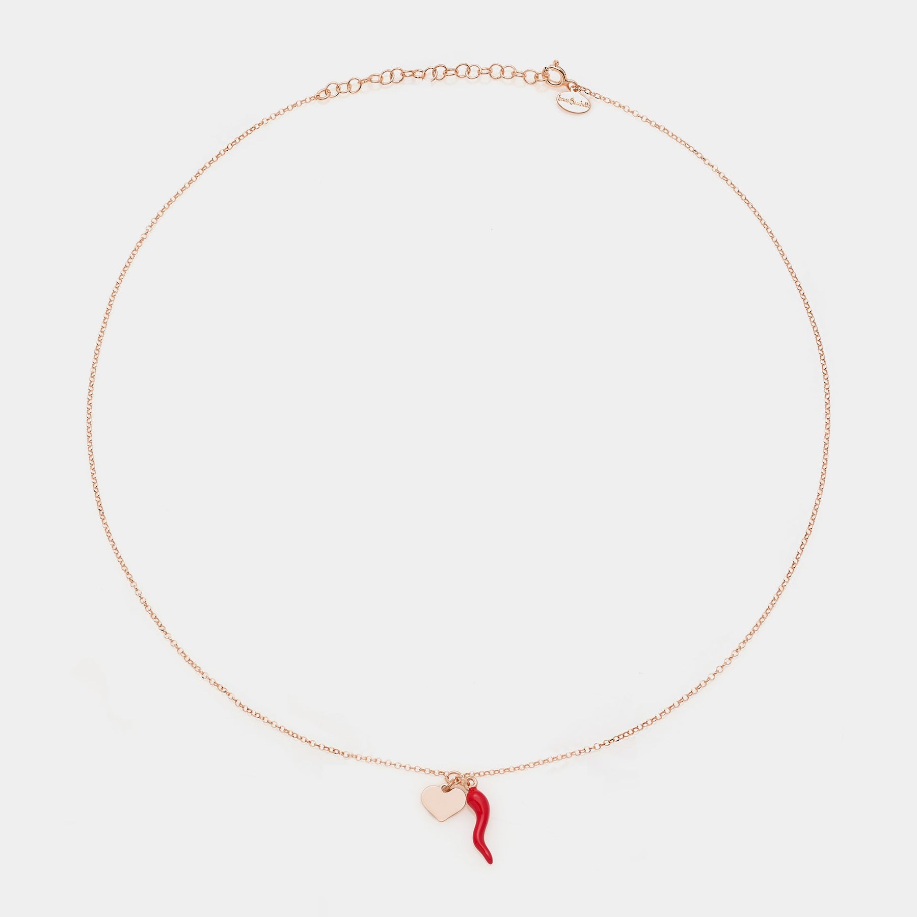 Rose gold silver necklace with enameled horn centerpiece and heart pendants