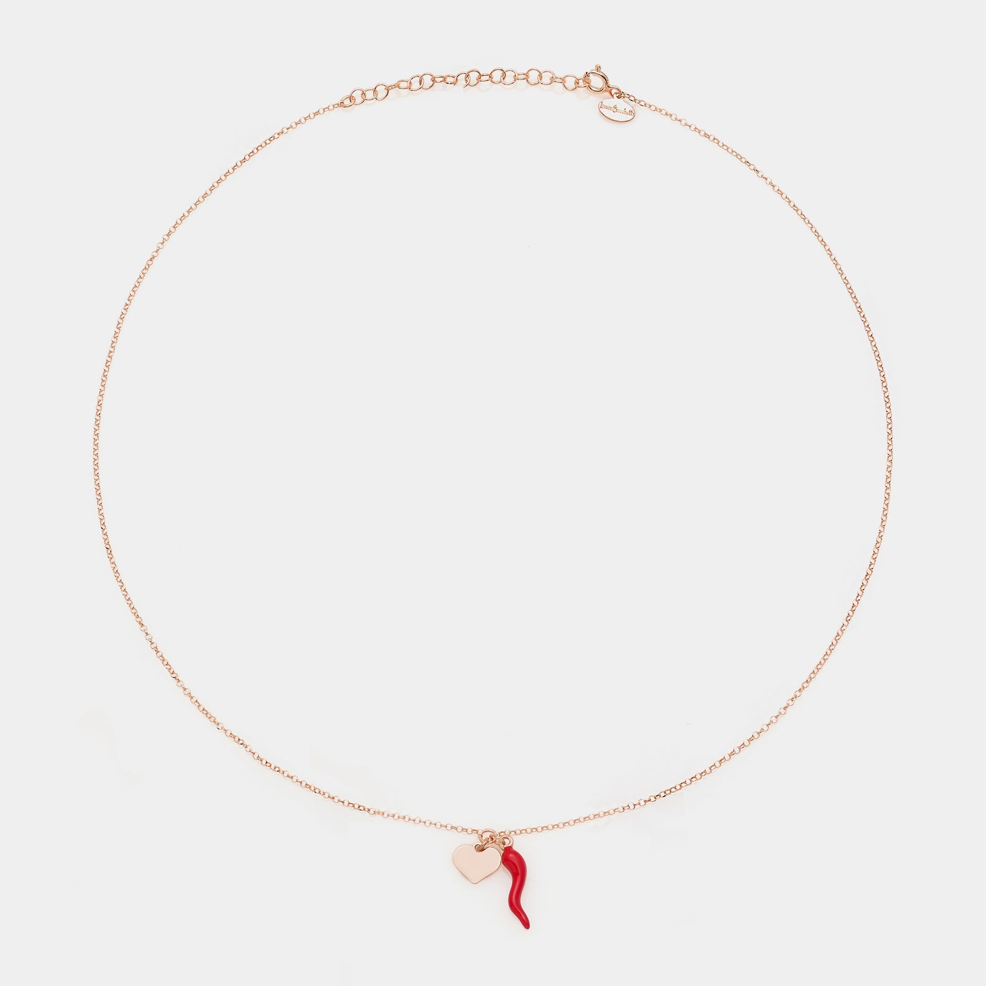 Rose gold silver necklace with enameled horn centerpiece and heart pendants