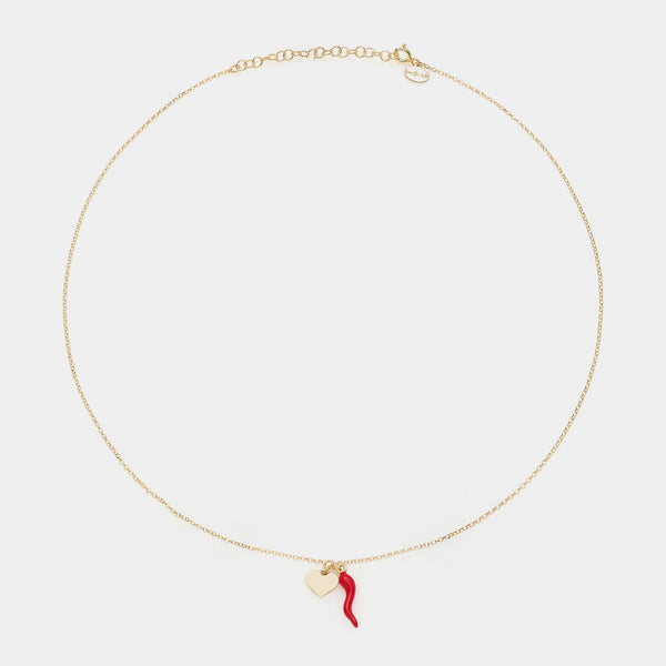 Gold-plated silver necklace with enameled horn centerpiece and heart pendants