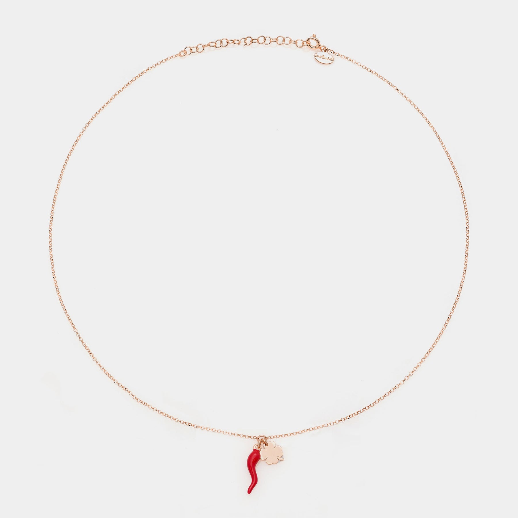 Rose gold silver necklace with enameled horn centerpiece and clover pendants