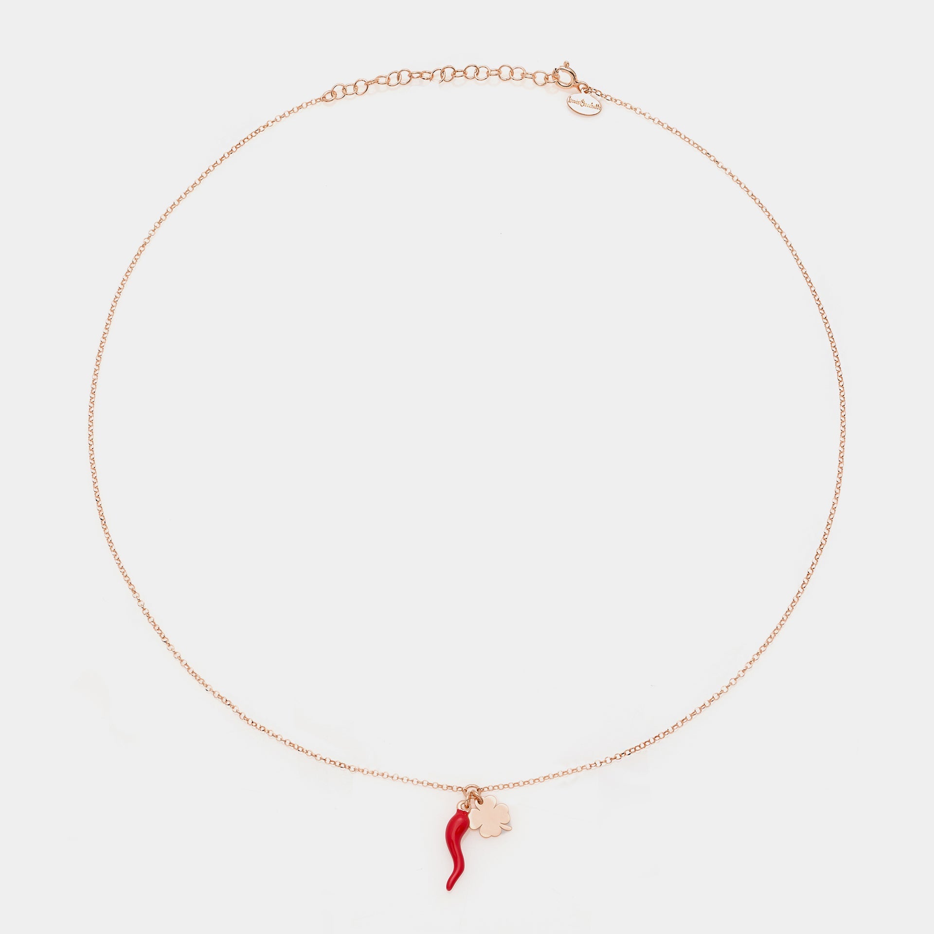 Rose gold silver necklace with enameled horn centerpiece and clover pendants