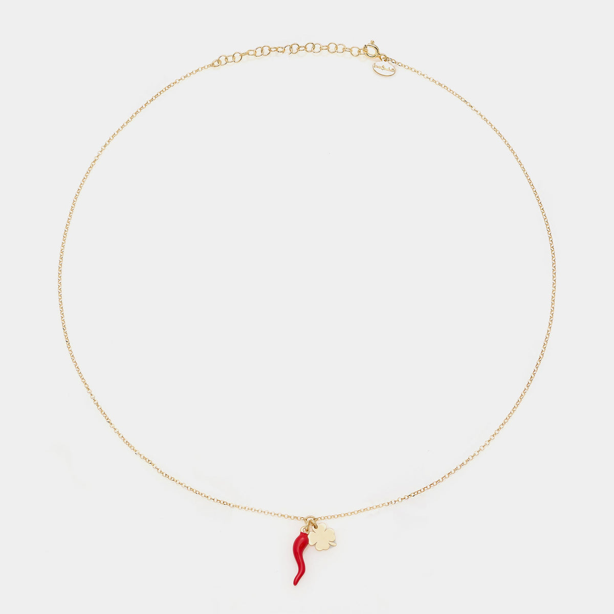 Gold-plated silver necklace with enameled horn centerpiece and dangling clover
