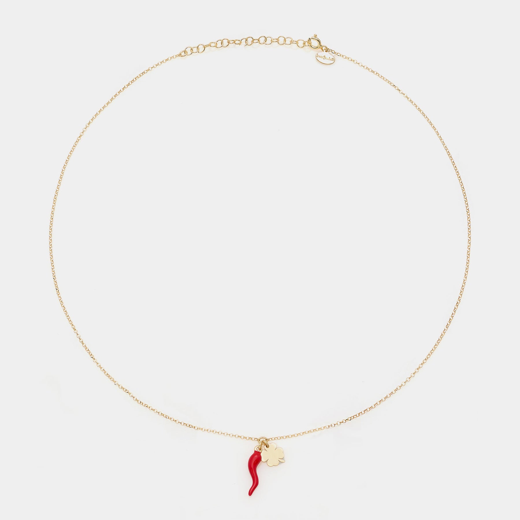 Gold-plated silver necklace with enameled horn centerpiece and dangling clover