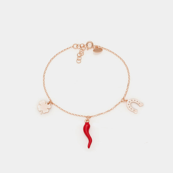 Rose gold plated silver bracelet with enameled horn, clover, and horseshoe pendants