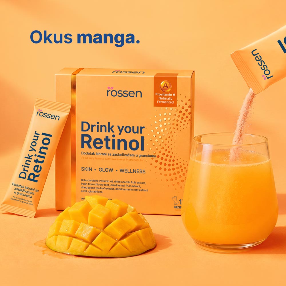 Promotional image of a retinol supplement box labeled 'Drink your Retinol' beside a mango and a glass of orange juice on an orange background.