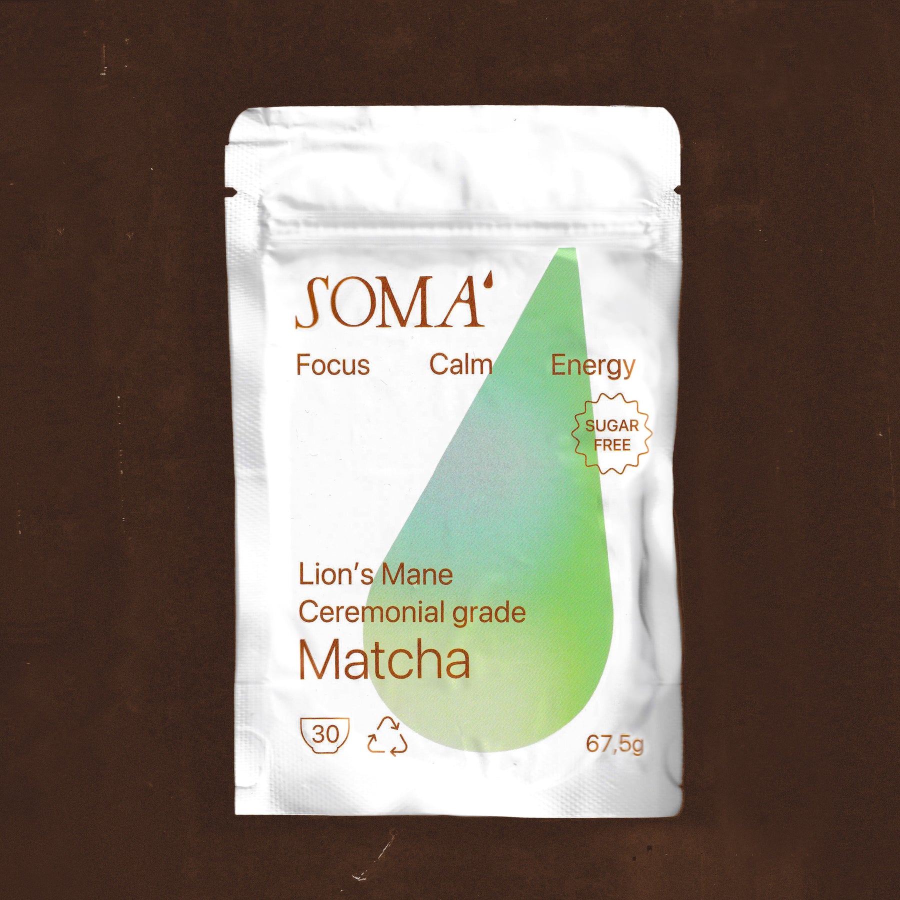 SOMA matcha packaging on a brown background