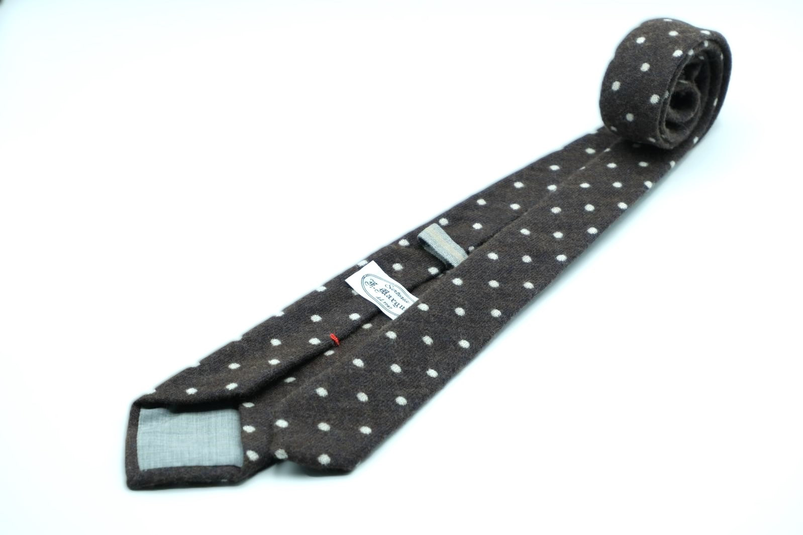 Dark brown tie with white polka dots in pure wool