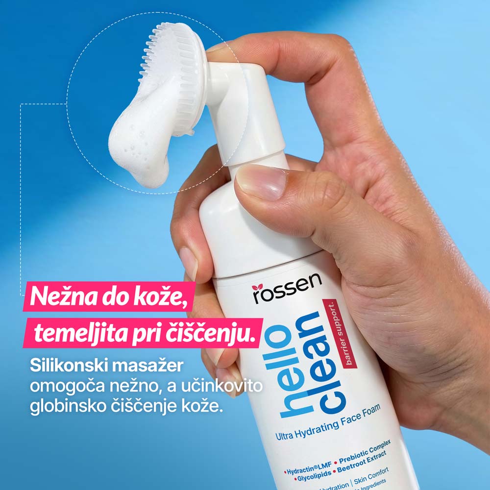 Close-up of a hand holding a facial cleanser bottle with a silicone massage head, foam on the brush, blue background; Croatian ad text highlights gentle, thorough cleansing.