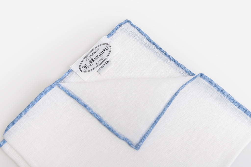 White linen clutch with blue border