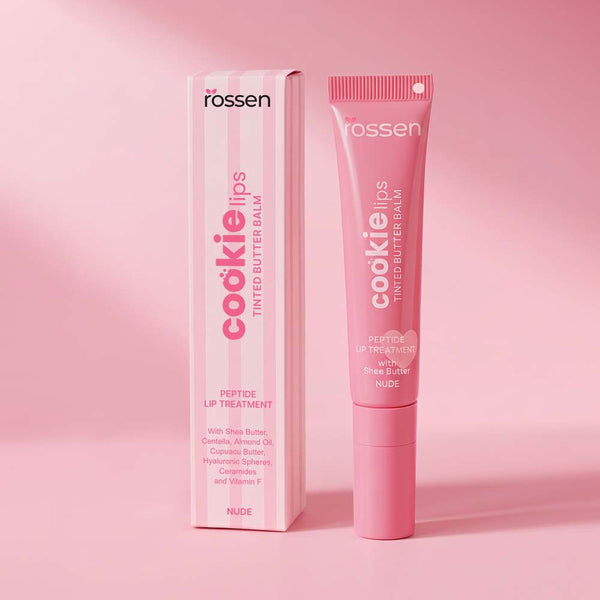 Pink tube and matching box for 'cookie lips' tinted butter balm by Rossen, nude shade, lip treatment set on pink background