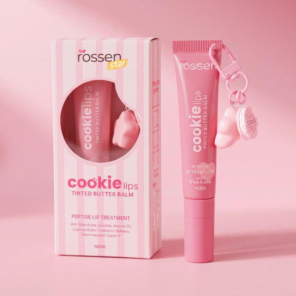 Pink cookie lips tinted butter balm set with box and tube, featuring a small keychain accessory, on a pink background.
