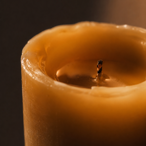 Close-up of a CocoBee beeswax pillar candle