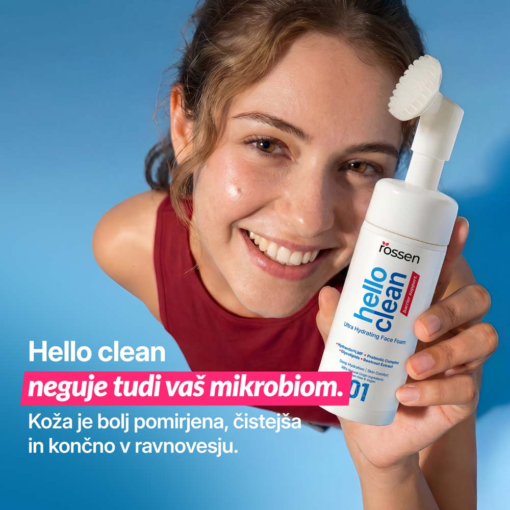 Smiling woman holding a white bottle labeled 'Hello Clean' facial foam; advert text about balancing the skin microbiome.