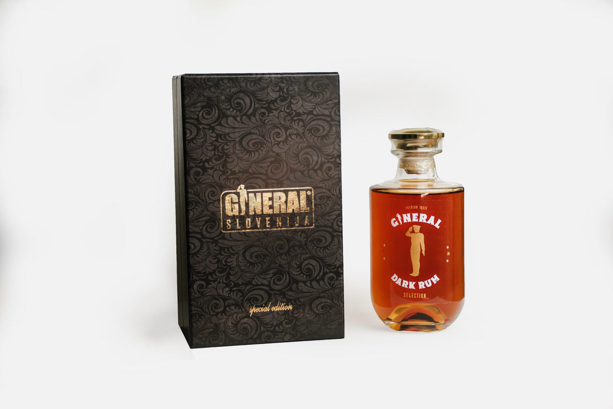 Black, ornate box with gold General Slovenija label beside a bottle of General Dark Rum with red liquid.