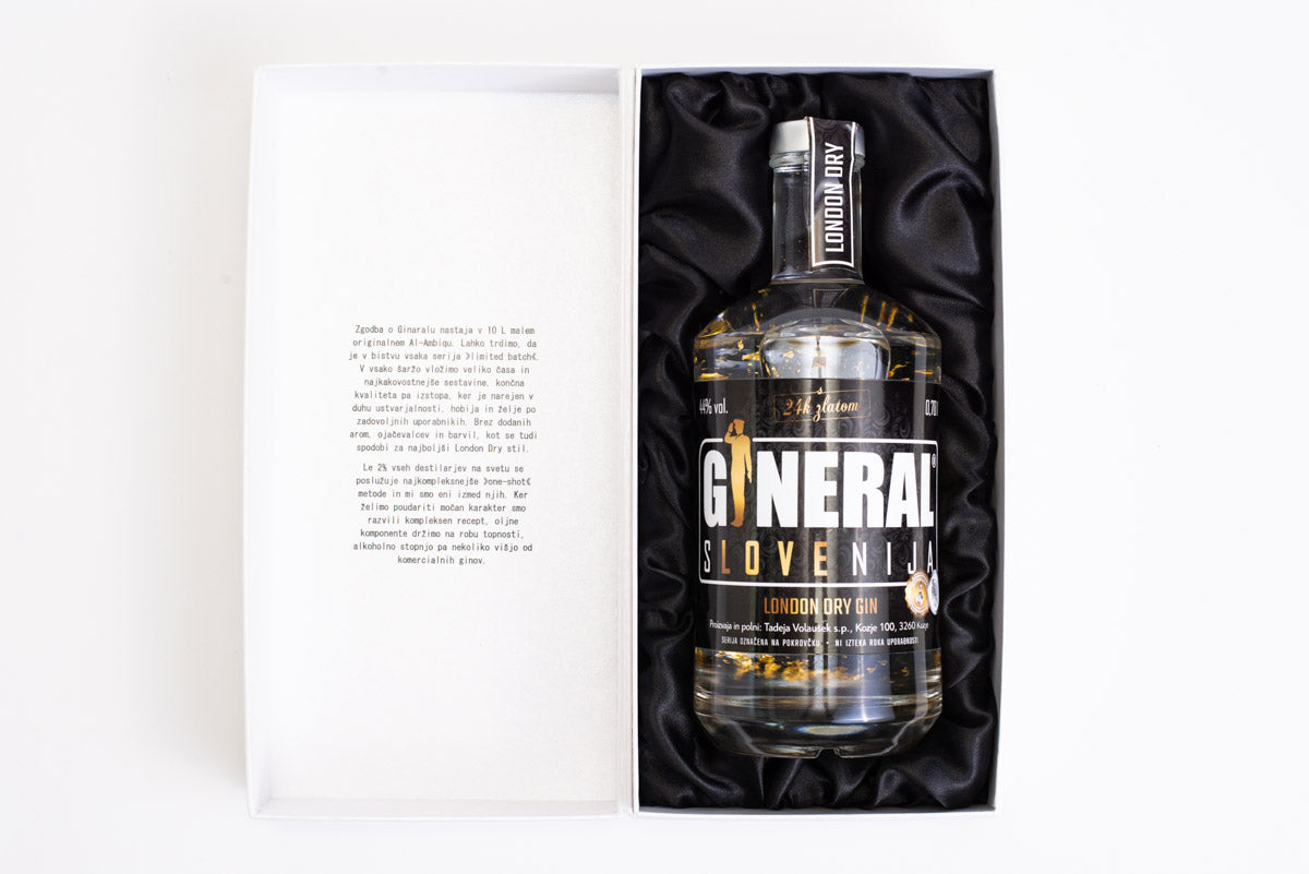 Gin bottle in a white gift box, cushioned by black satin lining, ready as a premium gift set.