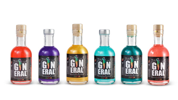 Six colorful gin bottles lined up in a row on a white background: red, purple, amber, turquoise, teal, and pink colors with dark labels.