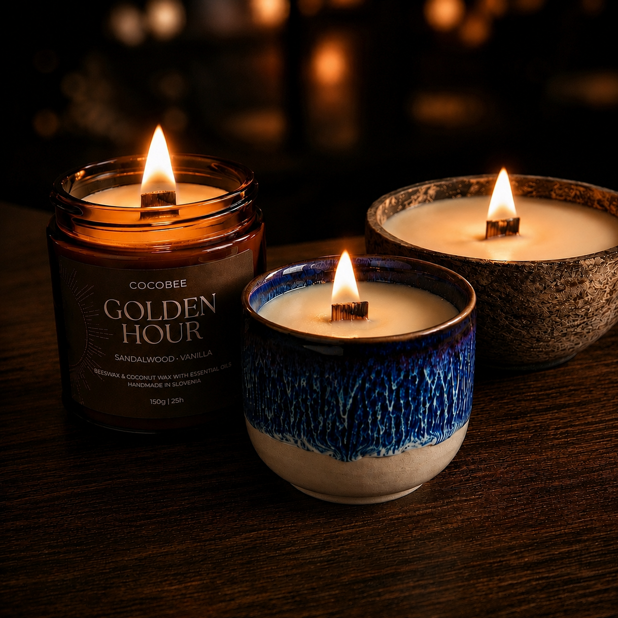 Three lit candles from the CocoBee Woodfire Collection