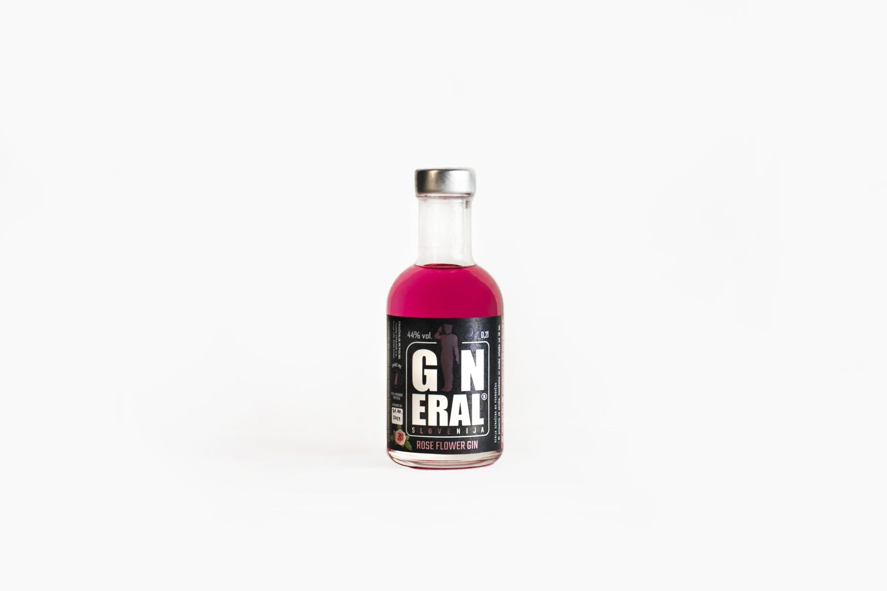 Pink gin bottle with a silver cap on a white background; label reads Rose Flower Gin.
