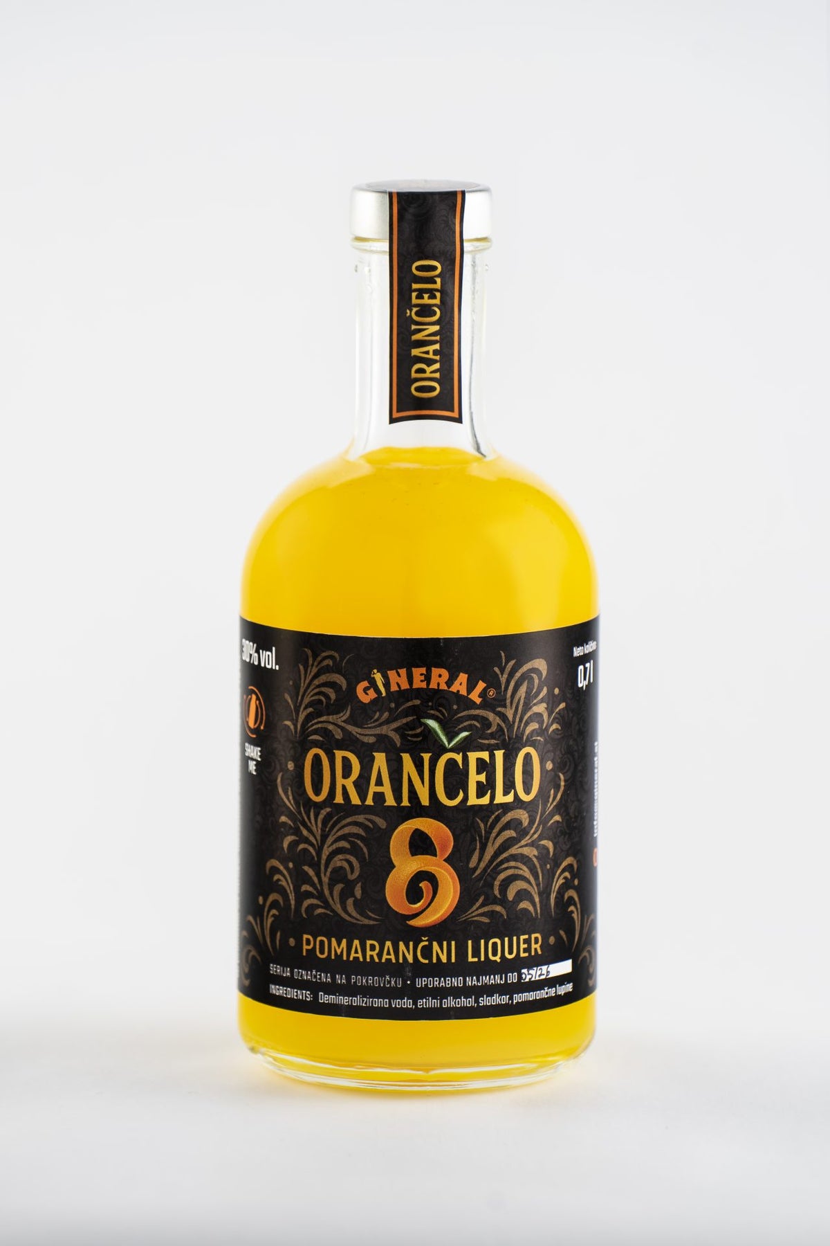 Bottle of Orangolo orange liqueur with a black ornate label and bright orange liquid.