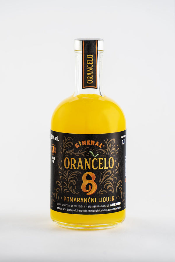 Bottle of Orangolo orange liqueur with a black ornate label and bright orange liquid.