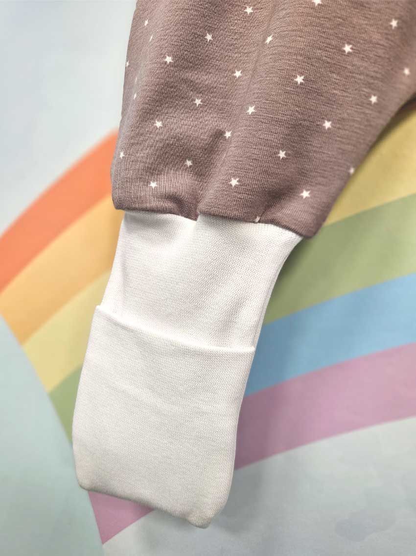 Tanja two-layer sleeping bag with legs and sleeves - White stars on a pink background